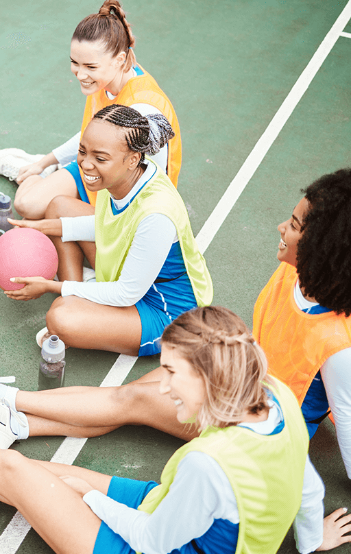 Womens netball team smiling